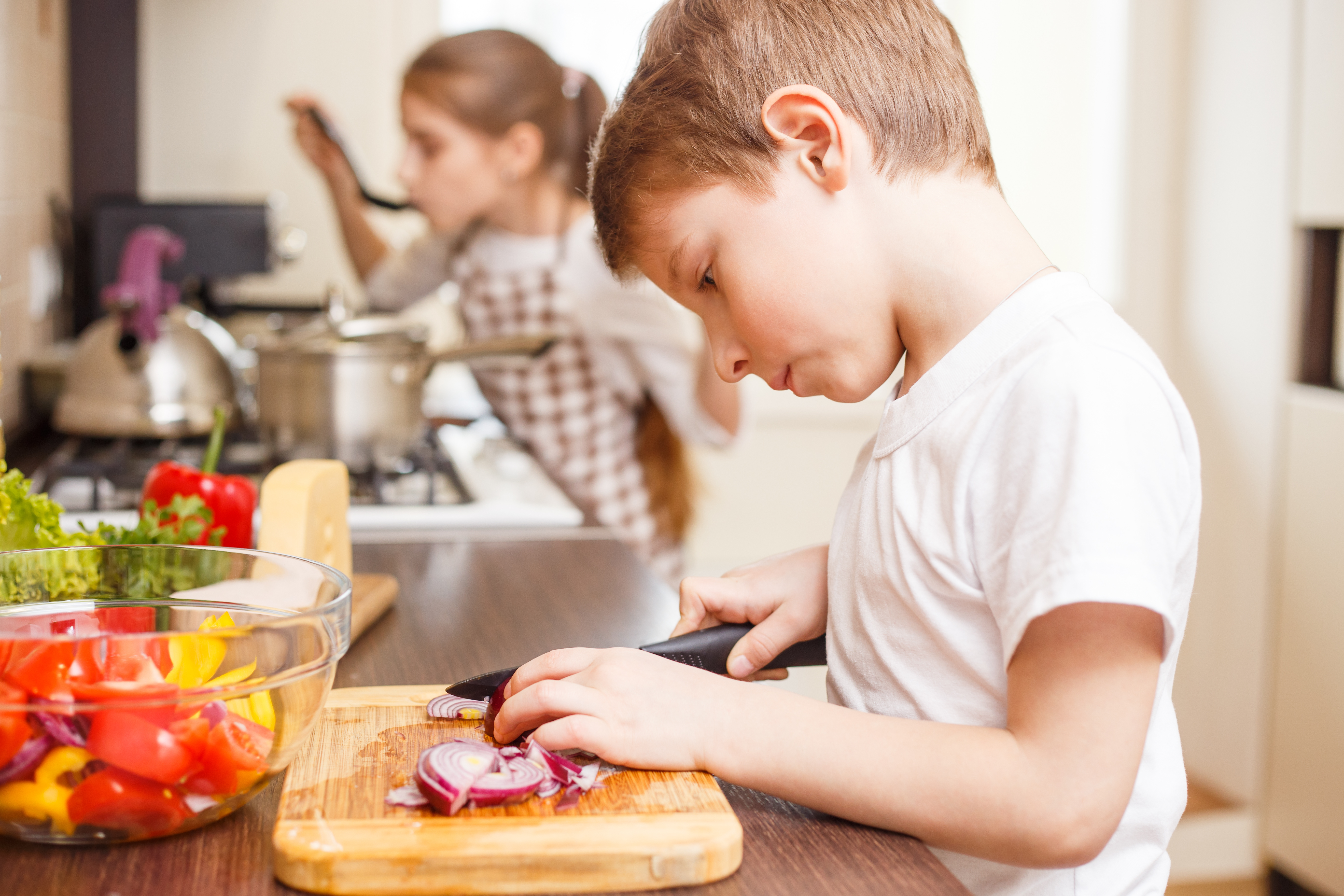 boy cutting onions