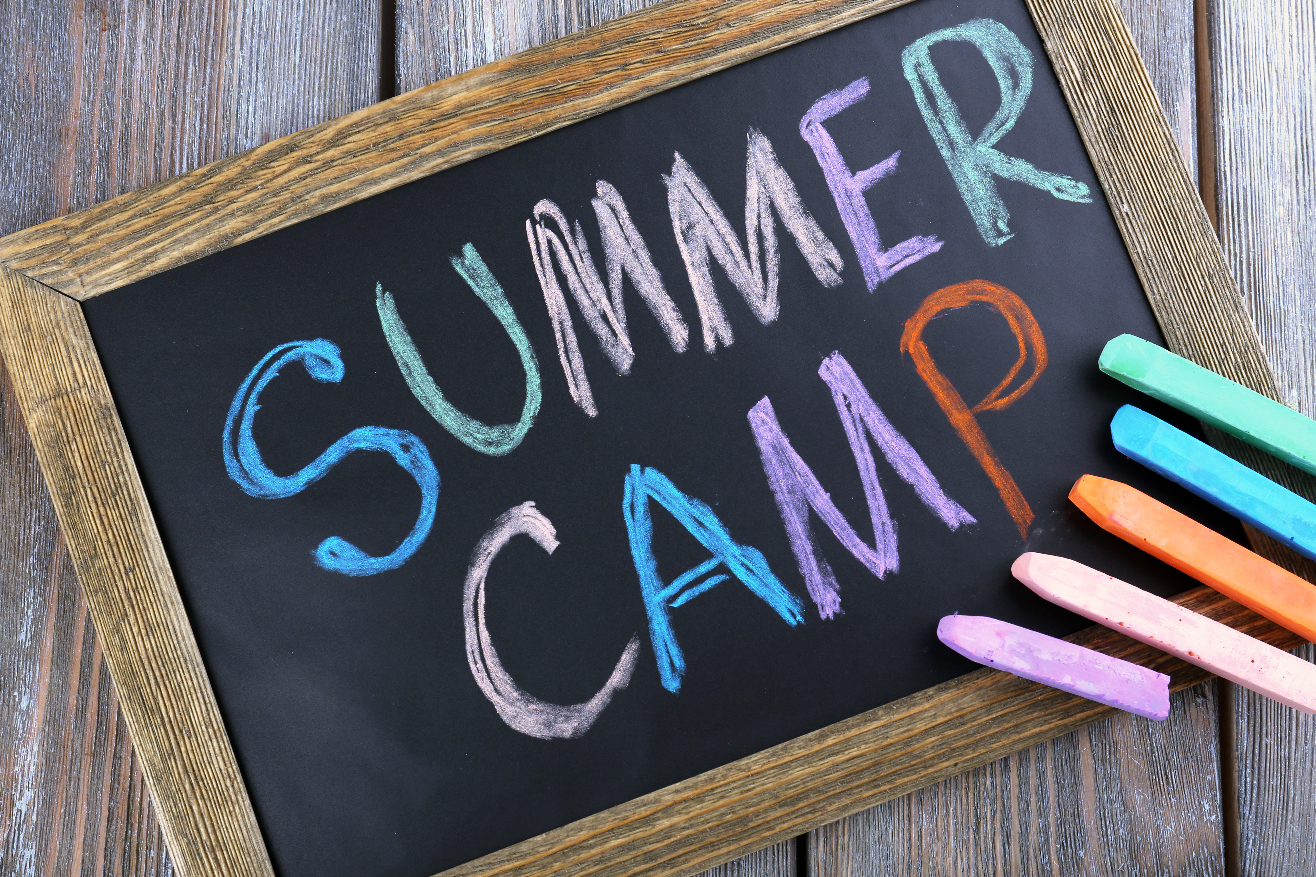 small chalkboard with summer camp written